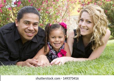 A young girl enjoys the afternoon with her family.