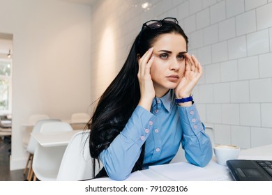 young girl experiencing stress from work in the office