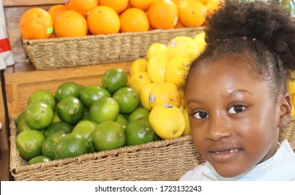 Young Girl With Face Mask In Produce Isle Of City Grocery Market Store