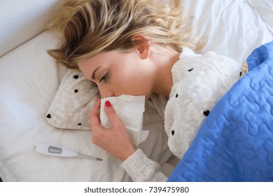 Young Girl Face Portrait Holding A Kleenex And Crying