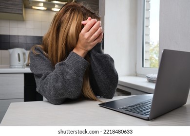 A young girl fell asleep in front of a laptop. Pretty woman is tired or overworked. Cozy home environment
 - Shutterstock ID 2218480633