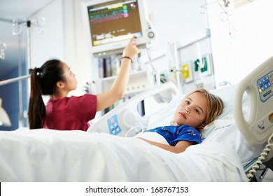 Young Girl With Female Nurse In Intensive Care Unit