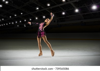 Young Girl Figure Skater In Sports Hall