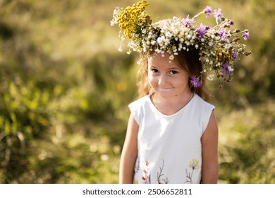 A young girl with a floral crown smiles softly while standing in a sunlit wildflower meadow, capturing the essence of innocence, nature, and childhood joy. - Powered by Shutterstock