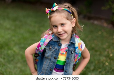 A Young Girl With Freckles Is Excited And Nervous For Her First Day Of School.
