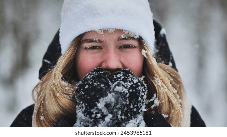 A young girl freezes in the woods in winter. - Powered by Shutterstock