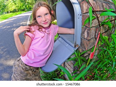 Young Girl Getting The Mail Out Of Streetside, Mailbox