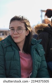 Young Girl With Glasses In Winter Clothes