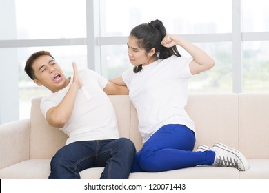 Young girl going to punch her boyfriend