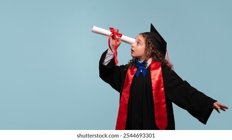 Young girl in graduation attire looking through diploma like a telescope. Graduate celebrating graduation. Education concept. Successful primary school. - Powered by Shutterstock