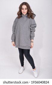 Young Girl In A Gray Sweatshirt. High Quality Photo