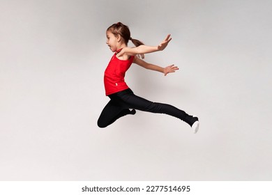 Young girl gymnast on white background with copy space. - Powered by Shutterstock