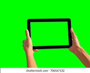 Young girl hand holding a tablet on green screen