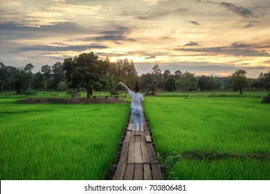 Young Girl Is Happy In Relax Time., Wooden Bridge 100 Years Old, Khok Grachai, Khon Buri In Nakhon Ratchasima At Thailand.