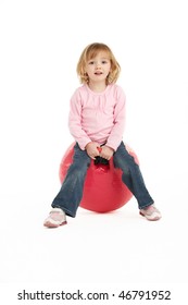 Young Girl Having Fun On Inflatable Hopper