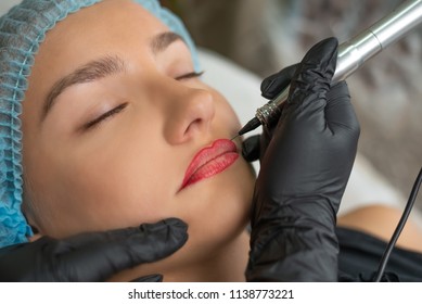 A Young Girl Having Red Lips Permanent Makeup, Micropigmentation.