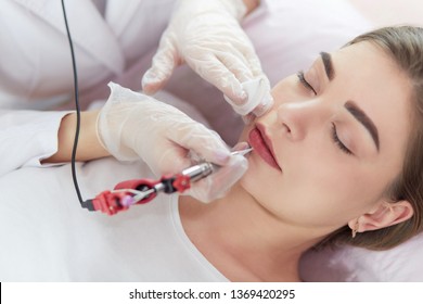 A Young Girl Having Red Lips Permanent Makeup, Micropigmentation