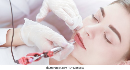 A Young Girl Having Red Lips Permanent Makeup, Micropigmentation