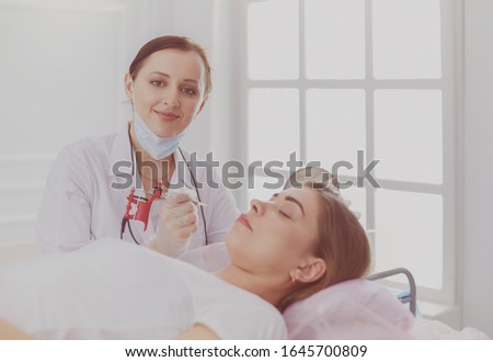 Similar – Female doctor comforting older patient