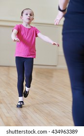 Young Girl Having Tap Dancing Lesson With Teacher