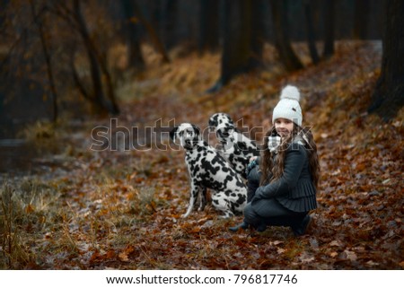 Similar – Foto Bild Herbstporträt eines glücklichen Kindes Mädchens, das mit ihrem Hund spielt.