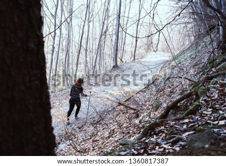 Young Girl Hiking in the forest with a stick in Bulgaria