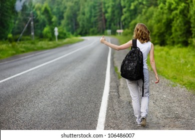 Young Girl Hitchhiking