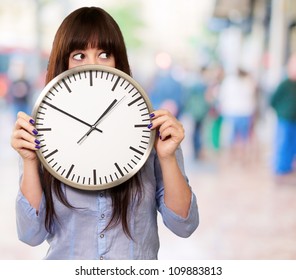 A Young Girl Holding A Clock, Outdoor