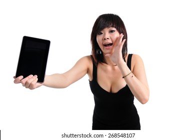 Young Girl Holding An Ipad Tablet Pc In Her Arms Over White Background