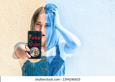 A young girl holding a smartphone with a broken screen, showing the inscription "fake user". The concept of online fraud.