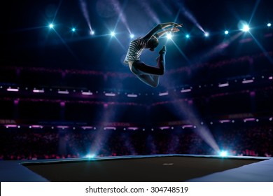 Young girl is jumping on the trampoline - Powered by Shutterstock