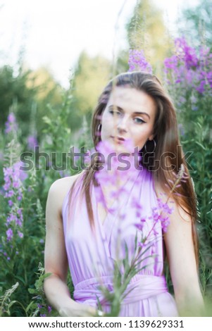 Similar – Woman posing in field of white flowers