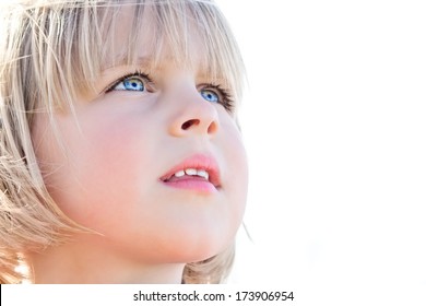 Young Girl Looking Up In Awe On White Background