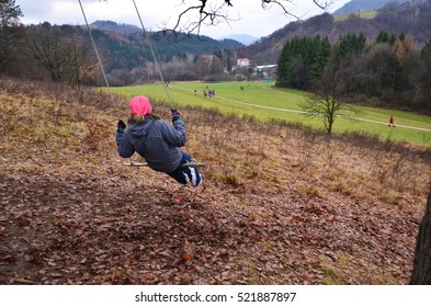 Young Girl Looking To The Runners On The Cross Country Track During Professional Competition - Sport Wallpaper With Space For Your Montage. Photo Concept For Orienteering Running,