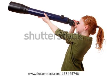 Young girl looks through a telescope on white background