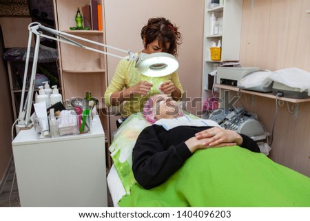 Similar – Image, Stock Photo Caregiver helping elderly female patient to get out of bed