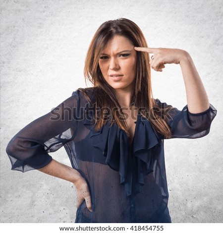 Young girl making crazy gesture