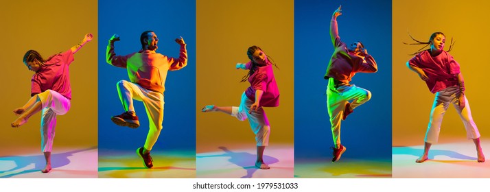 Young girl and man dancing hip-hop in bright attire on colorful background in neon light - Shutterstock ID 1979531033