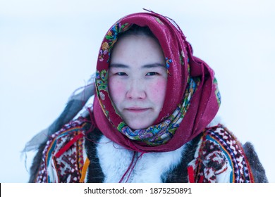 Young girl, in the national winter clothes of the northern inhabitants of the tundra, the Arctic circle