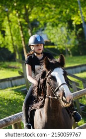 Young Girl On Horseback In An Equestrian Center