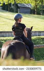 Young Girl On Horseback In An Equestrian Center