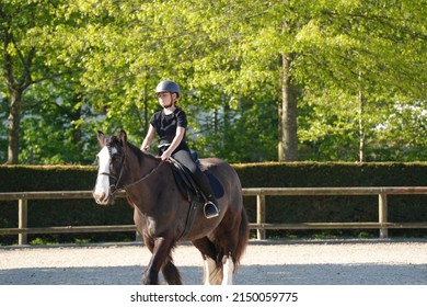 Young Girl On Horseback In An Equestrian Center