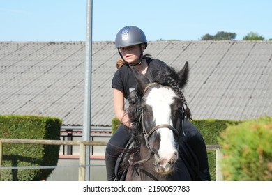 Young Girl On Horseback In An Equestrian Center