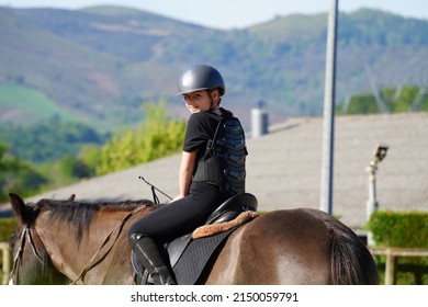 Young Girl On Horseback In An Equestrian Center