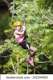 Young Girl On A Jungle Zip Line