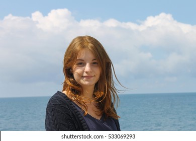 Young girl on sea background

