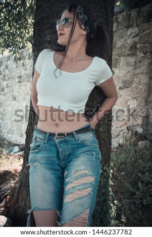 Similar – Brunette surfer woman with top and bikini holding surfboard