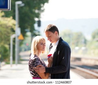 Young girl on train station says goodbye before catching her train - Powered by Shutterstock