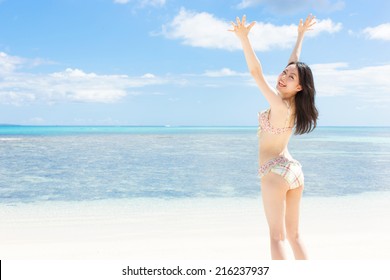 young girl on tropical island beach 