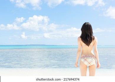 young girl on tropical island beach 